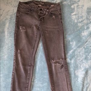 Faded black ripped jeans